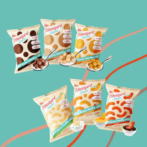 Packs of Schoolyard Snacks protein puffs and keto cereal displayed on a bright blue background.